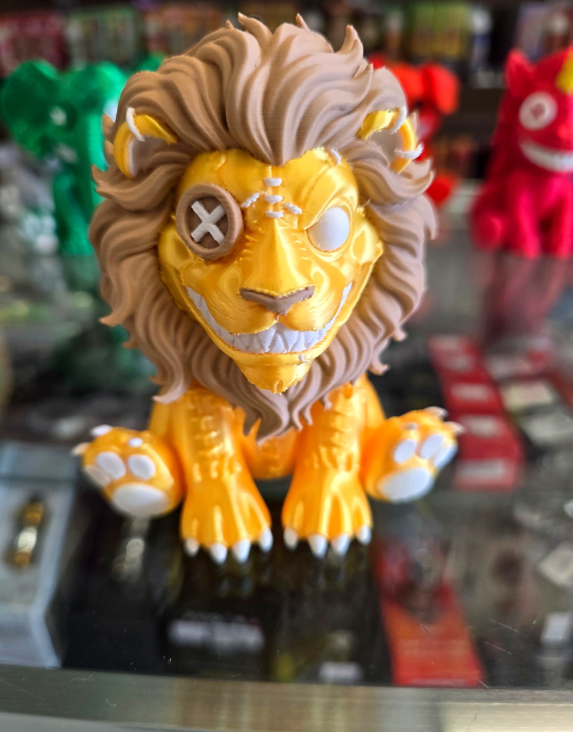Patchwork lion with a golden mane and crooked crown